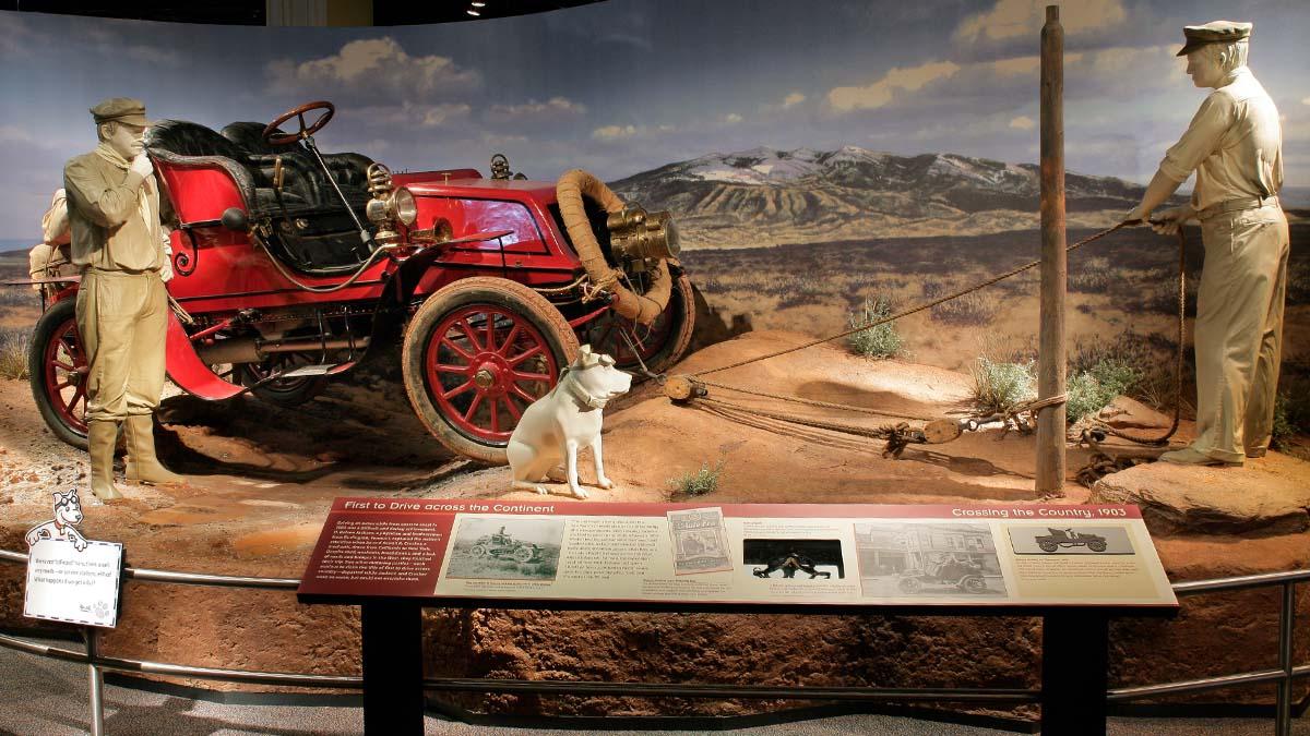 Exhibit scene featuring early automobile